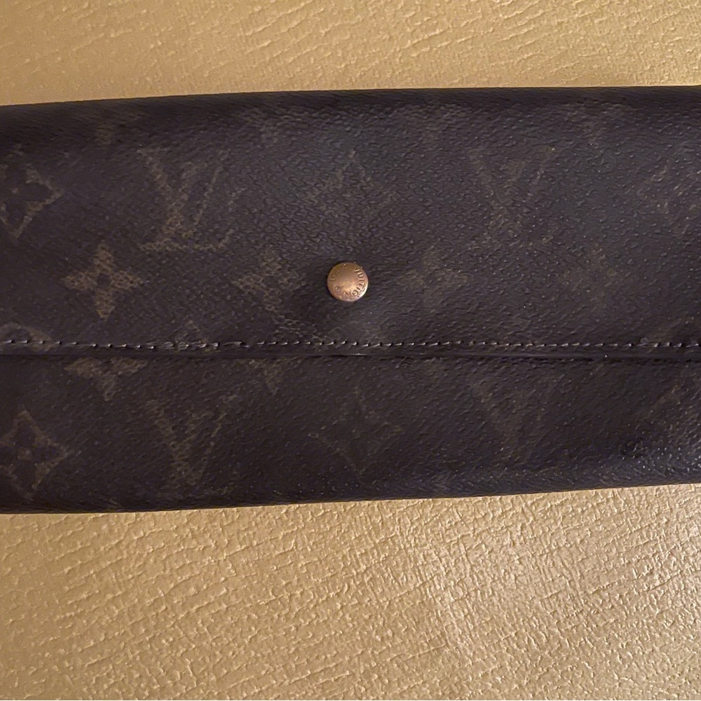 Louis Vuitton Sarah Wallet….. date code is faded due to wallet being really old